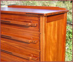 Close-up of Drawer fronts with Ebony caps and dresser top with Ebony splines. 